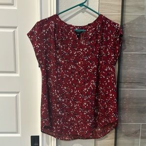 Red flowered blouse.